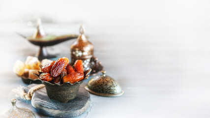 old vase with dates and a Cup of tea. Beautiful still life for a Muslim holiday.