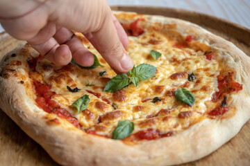 classic pizza margherita with mozzarella and basil, make pizza at home