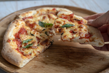 classic pizza margherita with mozzarella and basil, make pizza at home