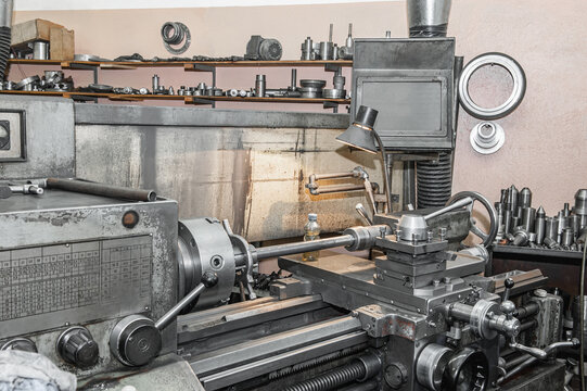 old Metalworking machine is working. Turning production. Using old technologies in times of crisis and stagnation