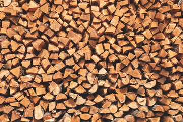Oak chopped firewood stacked to form a texture