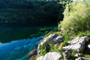 The emerald waters of Lake Cornino in the Cornino regional nature reserve, Italy