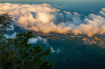 Fototapeta premium Beautiful landscape of mountains with clouds floating below. Mountain landscape with clouds