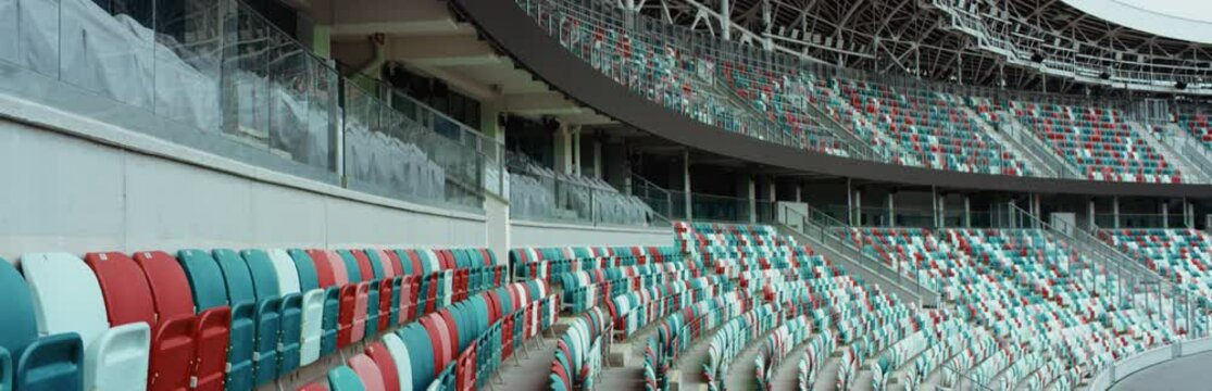WIDE View of empty stadium seats before game or during Coronavirus COVID-19 pandemic. Shot on RED cinema camera