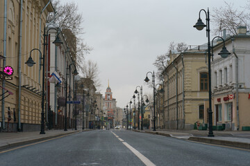 Fototapeta na wymiar Moscow street in the spring day. Almost nobody. Almost no traffic. Coronavirus pandemic time. Lockdown lifestyle.