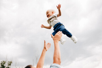 A happy family walks with a child in nature