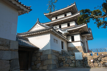 Fototapeta na wymiar The Ushitora yagura at Takamatsu Castle (Tamamo Park) in Takamatsu, Kagawa, Japan. The Castle originally built in 1590 and part of Japan's Top 100 Castles.
