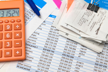 business office desk closeup - financial reports, analysis and accounting, set of documents, tables and graphs, various items for bookkeeping, calculator