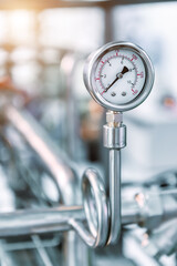 Pressure gauges mounted on the pipeline.
