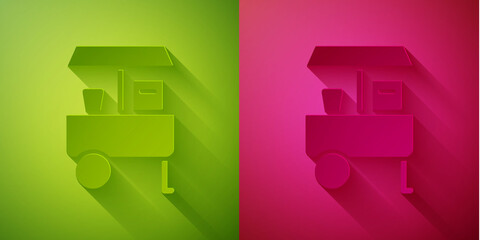 Paper cut Fast street food cart icon isolated on green and pink background. Urban kiosk. Paper art style. Vector.