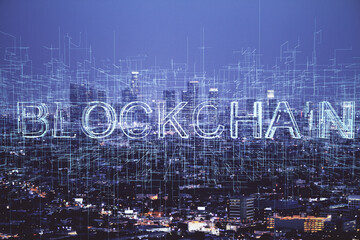 Multi exposure of cryptocurrency theme hologram drawing and city veiw background. Concept of blockchain and bitcoin.