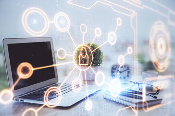 Computer on desktop with social network hologram. Double exposure. Concept of international people connections.