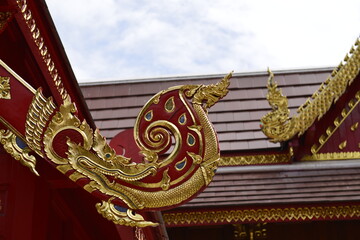 Thai art sculpture on the roof of buddhist sanctuary Wat Phra That Sri Chom Thong in Chiang Mai...