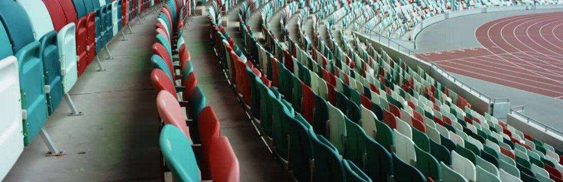 WIDE View of empty stadium seats before game or during Coronavirus COVID-19 pandemic. Shot on RED cinema camera