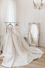 Fototapeta na wymiar wedding dress on a hanger in a light studio.
