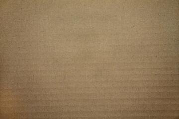 Fototapeta na wymiar Texture of a cardboard surface in brown.
