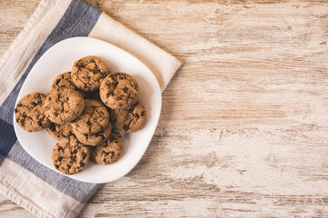 some chocolate cookies on a white plate