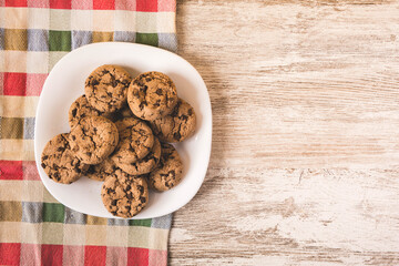 some chocolate cookies on a white plate