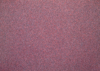 Fototapeta premium Fine emery paper texture. In a red purple version.