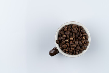 Roasted burundi special coffee beans on white background, isolated, studio shot, ad photo with a text space