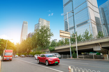 The city's tall buildings and high-speed cars, the urban landscape of Beijing, China.