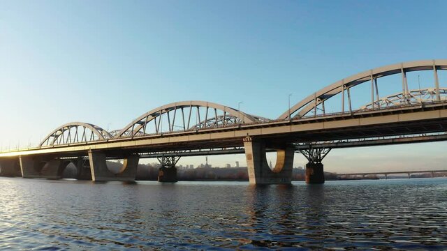 Aerial drone video of  a bridge. Modern automobile and old railway bridges in Kiev. Kyiv, Ukraine.