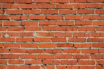 Old red brick wall in an abandoned building