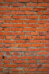 Old red brick wall in an abandoned building