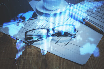 Business theme hologram with glasses on the table background. Concept of search. Double exposure.