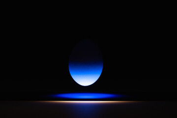 Blue egg levitating over a black glass table