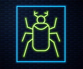 Glowing neon line Beetle bug icon isolated on brick wall background. Vector.
