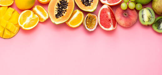 Summer fruits backround. Various fruits on pink background. Summer concept. Banner with copy space.