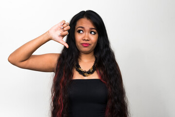 Portrait of young Asian woman against white background