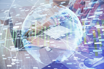 Multi exposure of businessman working on laptop on background. International business hologram in front. Concept of success.
