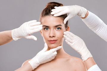 Naklejka premium Attractive young woman getting treatment at beauty clinic
