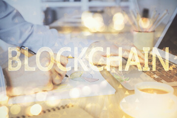 Blockchain theme hud with man working on computer on background. Concept of crypto chain. Double exposure.