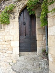 Fototapeta na wymiar La roque gageac, France - July 2, 2020: medieval door in the historic old town village , Périgord, Dordogne, France