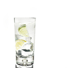 Glass of gin and tonic with ice and lime