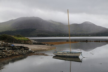 A yacht moored in the Kenmare River off the shore at Kilmakilloge, County Kerry, Ireland.