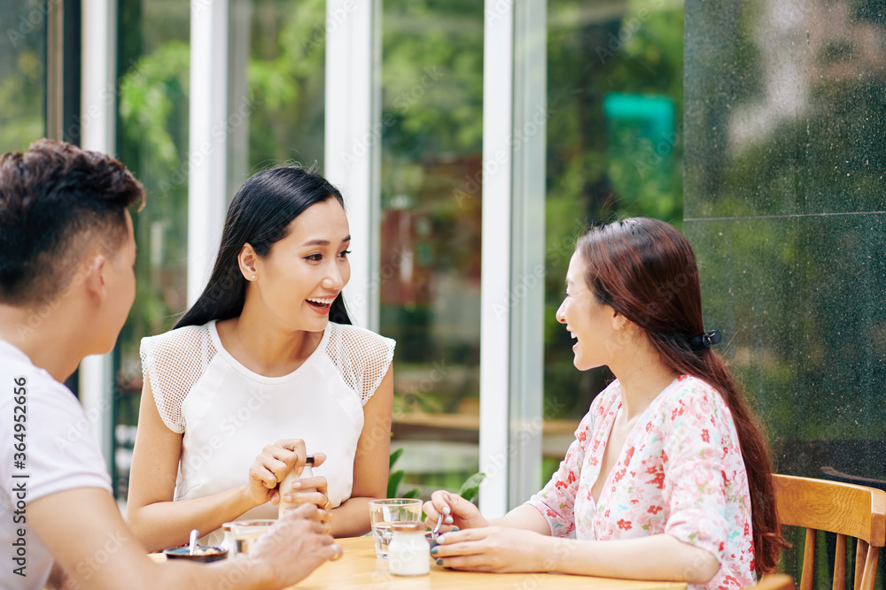 Canvas Prints Group of happy friends eating breakfast in outdoor cafe