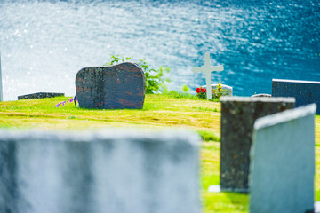 Churchyard in Nes village at fjord, Norway