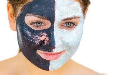 Girl remove black white mud mask from face
