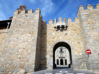 The Gate of St. Teresa (Puerta de la Santa) of the city wall of Avila, SPAIN. Which at back is the...