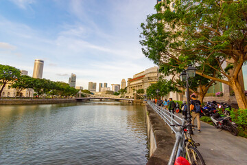 An array of multi-storey buildings in the middle of the field with river on sky background in singapore city. decoration image contain certain grain noise and soft focus.