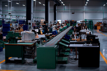 Shoe making process in footwear factory.