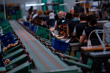 Shoe making process in footwear factory.