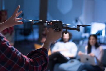 Young team of experienced professionals planning the development of new successful project. Diverse group of architects working in coworking office using modern technology.