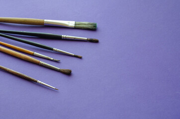 Set of random brushes for painting on blue background.