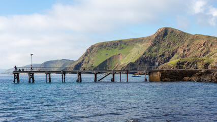 The iconic jetty with rolling green hills in the background  on the fleurieu peninsula at second...