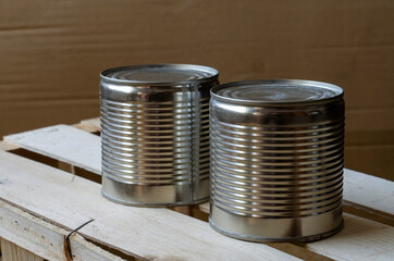 Two metal shut jars of ready-to-eat food.